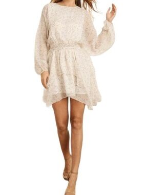 Storia Cream Whimsy Flowy Dress with star print and Ruffle Hem